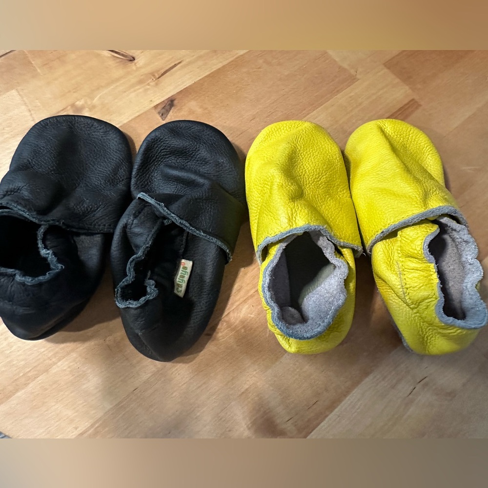 Black and yellow  soft sole shoes. No size but they fit 2 year -3year
